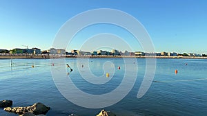 Timelapse of unidentifiable people in the late afternoon on Caorle beach in Veneto, Italy