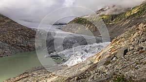 Timelapse, view of melting glacier in the Swiss Alps. Rhone Glacier, the source of the river Rhone. Furka Pass, Canton Valais,