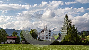 Timelapse view of Muenichau castle with Wilder Kaiser mountain massif