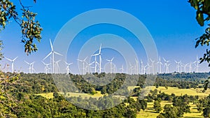 Timelapse of wind turbine farm in beautiful nature with blue sky blackground, generating electricity