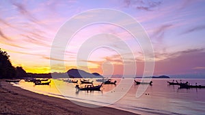 Timelapse of wooden boat Longtail fishing boats at Rawai beach Phuket Thailand Beautiful Light of nature Sunrise over sea Amazing