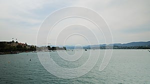 Timelapse of Zurich Lake at weekend. Boats, yachts, catamarans floating on water