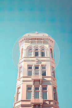 timeless beauty of an old building against the backdrop of a clear blue sky.