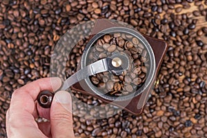 Timeless Ritual: Grinding Coffee Beans in a Retro Coffee Mill - Retro and Vintage Food and Drink Concept