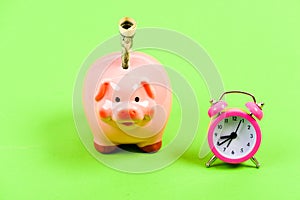 Timely accruals. business startup. financial position. piggy bank with alarm clock. Moneybox. success in finance and