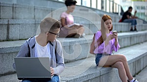 Timid male pupil laptop feeling shy looking pretty female classmate insecurities