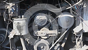 Timing belt alternator belt in motion on a running car engine