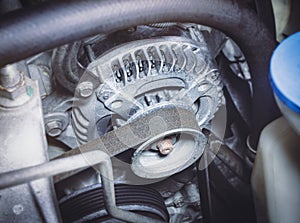 Timing belt of car alternator in benzine engine photo