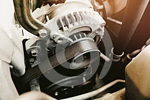 Timing belt of car alternator in benzine engine photo