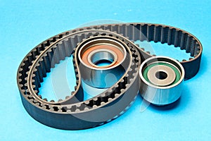 Timing belt with rollers on background .Kit of timing belt for car engine
