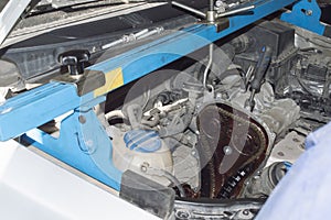 The timing chain drive of a three-cylinder gasoline engine installed under the hood of the car