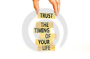 Timing of your life symbol. Concept words Trust the timing of your life on wooden blocks on a beautiful white table white