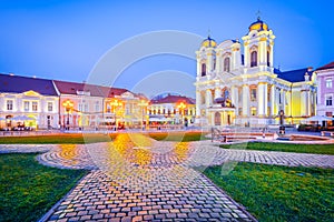 Timisoara, Banat - Romania. Night scene with Union Square, beautiful baroque Catholic Cathedral