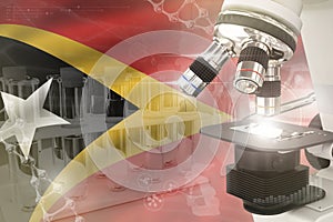 Timor science development digital background - microscope on flag. Research of pharmaceutical industry design concept, 3D