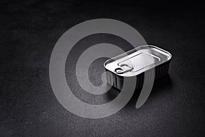Tin or aluminum rectangular can of canned food with a key