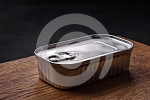 Tin or aluminum rectangular can of canned food with a key