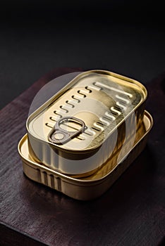 Tin or aluminum rectangular can of canned food with a key