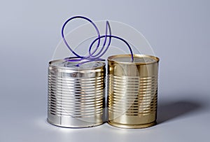 Tin can phone.communication concept on gray