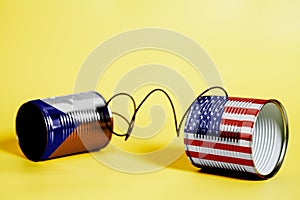 Tin can phone with USA and Czech Flags.communication concept