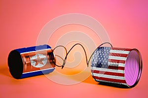 Tin can phone with USA and North Korea Flags.communication concept