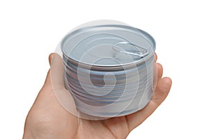 Tin can with ring in hand. Isolated