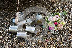 Tin cans and bridal bouquet