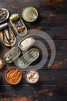 Tin cans for fish with different types of seafood, opened and closed cans with Saury, mackerel, sprats, sardines, pilchard, squid