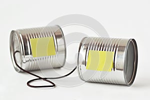 Tin cans phone with paper note - Communication concept