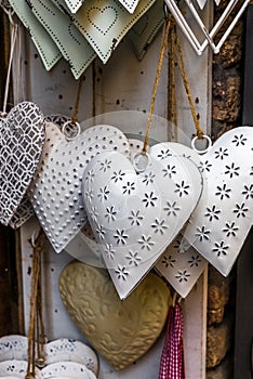 Tin hearts hanging on a window