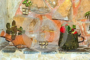 Tin mug and clay jug with flowers, Rethymno, Crete