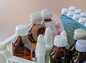 Tinctures, medicines for eyes and nose, pills close-up. Medical background for business, pharmacy.