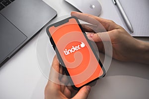 Tinder logo on smartphone screen