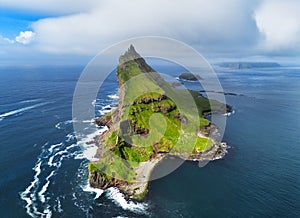 Tindholmur on Faroe Islands Vagar, aerial drone view during day in North Atlantic Ocean. Faroe Islands, Denmark, Europe photo