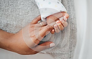 The tiniest hands hold my heart. a mother holding her babys hand.