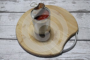 Tinned tomatoes on a chopping board