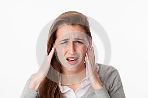 Tinnitus concept , 20s woman suffering from noise or having jaw ache photo