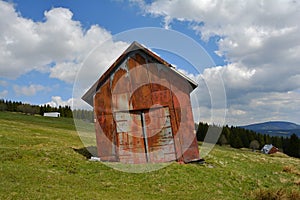 Tinny Rusty Barn (Hut) on Mountain Meadow, Giant Mountains, Czech Republic, Europe