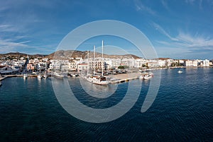 Tinos island Hora town Cyclades Greece. Aerial drone view of port, sea, blue sky, summer holiday