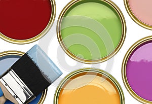 TINS PAINT WITH BRUSH ON WHITE BACKGROUND