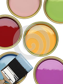 TINS OF PAINT WITH BRUSH ON WHITE BACKGROUND