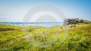 Ruins with green landscape at Tintagel castle in Cornwall, England