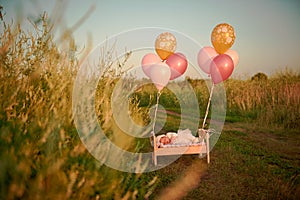 Tiny baby asleep in his crib in lace bonnet A in in cap and flies away with balloons