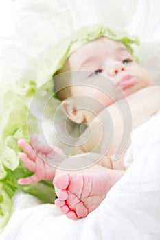 Tiny baby's foot, baby in cabbage