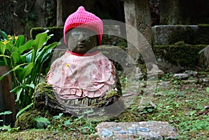 Tiny budda with a red hat at Mount Koya, Japan. photo