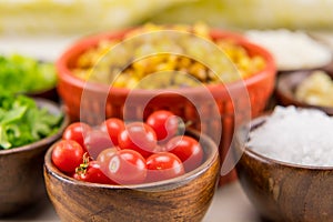 Tiny Cherry Tomatoes in Wooden Bowl