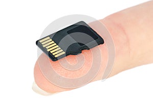 Tiny flash memory card on fingertip