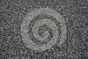 Tiny gravel texture on grey concrete wall. Texture background seamless gravel floor