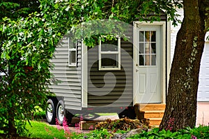 Tiny gray mobile home for glamping