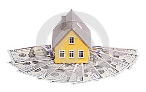 Tiny house and money isolated. Mortgage photo