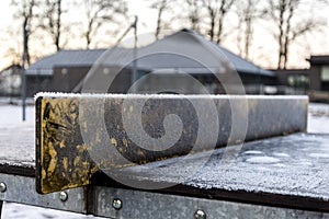 Tiny icicles on a tennis table improvised board net in one of the outdoor parks in Stavanger city